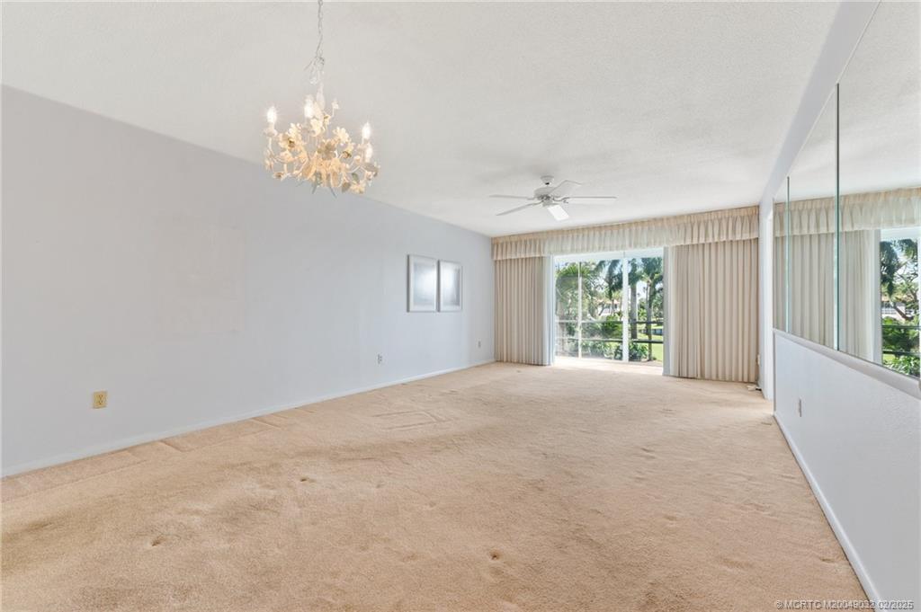 1907 Southwest Palm City Road, Unit 4J Stuart, FL 34994 - Photo 5 of 34 a view of an empty room with a window