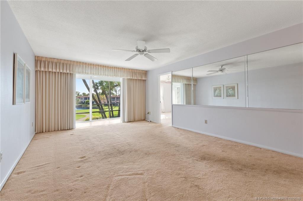 1907 Southwest Palm City Road, Unit 4J Stuart, FL 34994 - Photo 6 of 34 a view of an empty room with a window