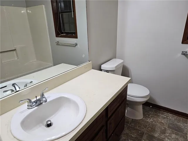 a bathroom with a sink and a toilet