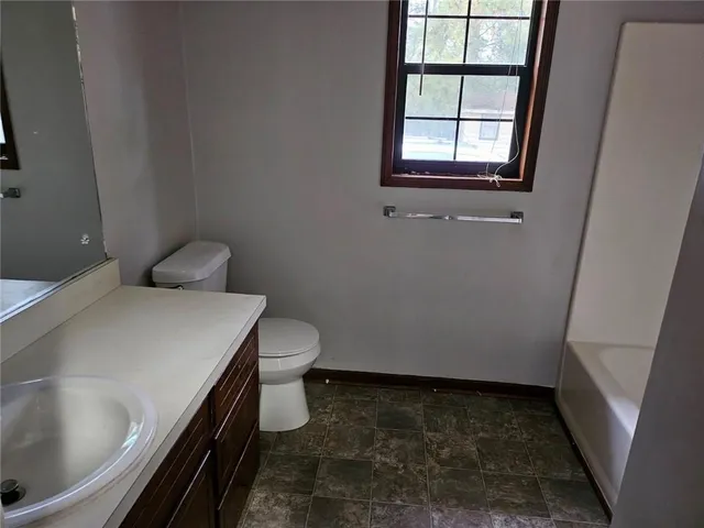 a bathroom with a sink and toilet