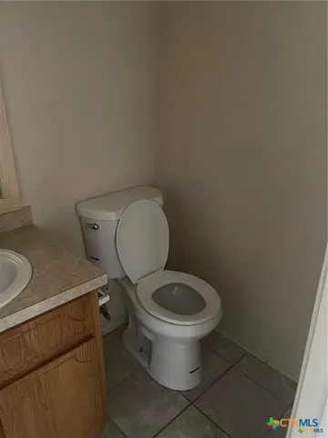 a bathroom with a toilet and a sink