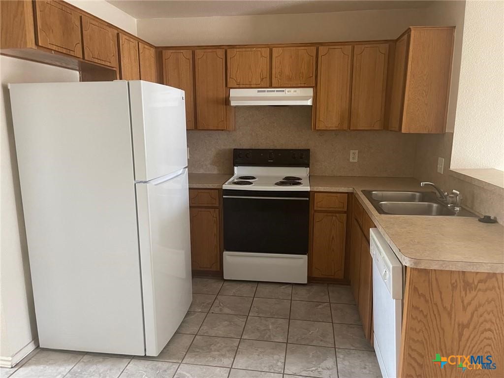 2712 Vernice Loop, Unit C Killeen, TX 76549 - Photo 17 of 24 a utility room with cabinets washer and dryer