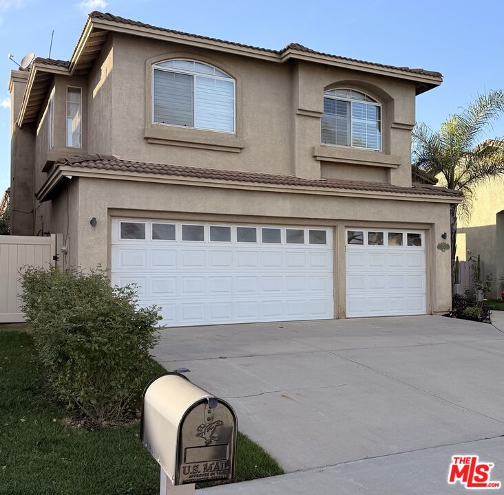 21321 Alvar Place Carson, CA 90745 - Photo 2 of 4 a front view of a house with a garden