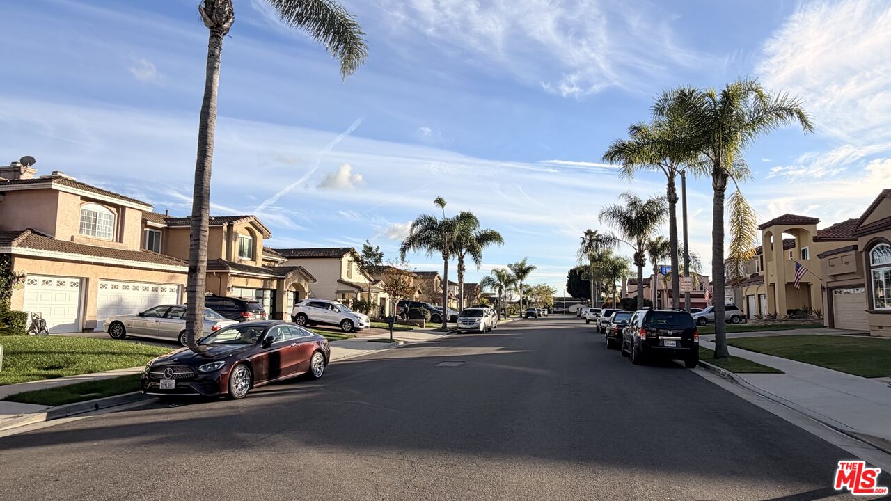 21321 Alvar Place Carson, CA 90745 - Photo 3 of 4 a view of a street with cars on the road