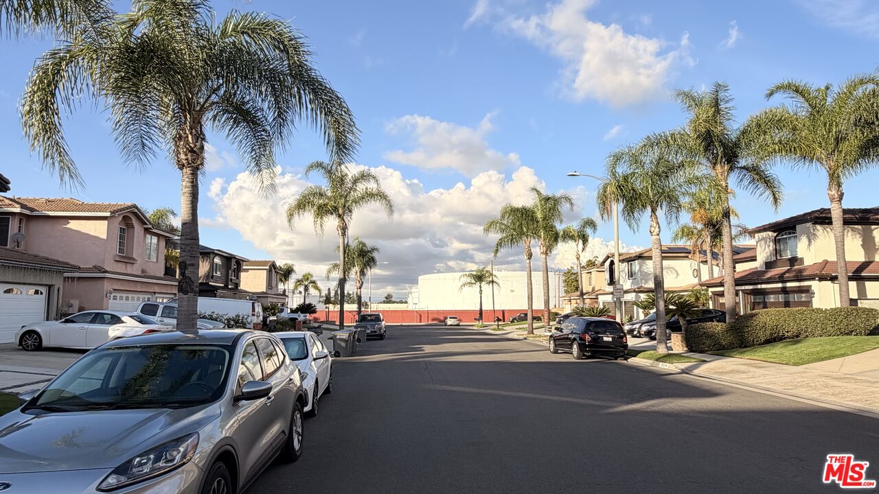 21321 Alvar Place Carson, CA 90745 - Photo 4 of 4 a view of a city street lined with parked cars
