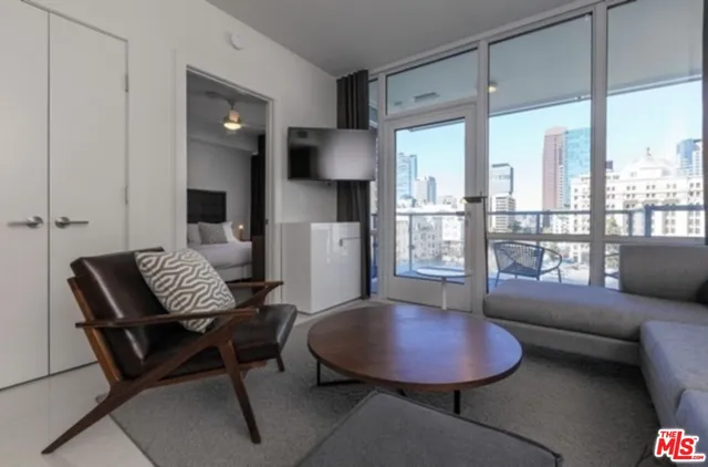 a living room with furniture and a large window
