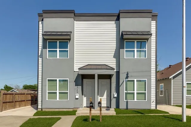 front view of a house with a yard
