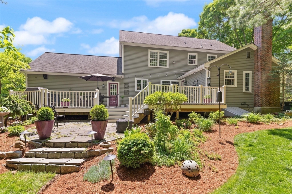 67 Bridle Path Franklin, MA 02038 - Photo 30 of 35 a front view of a house with garden