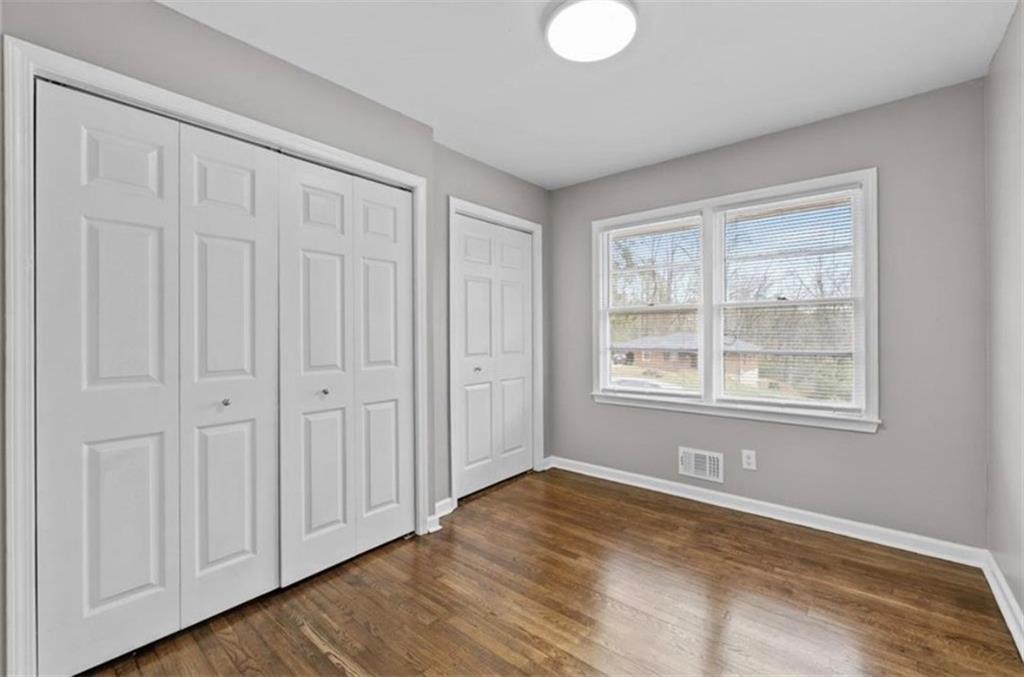 2911 Gresham Rd S East Atlanta, GA 30316 - Photo 13 of 22 a view of an empty room with wooden floor and a window