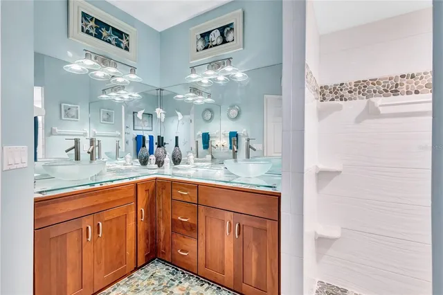 a bathroom with a sink a toilet and a shower curtain