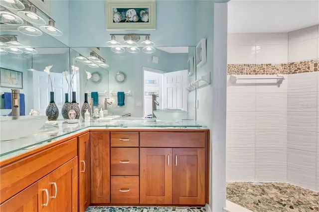 a bathroom with a granite countertop sink a toilet and a mirror