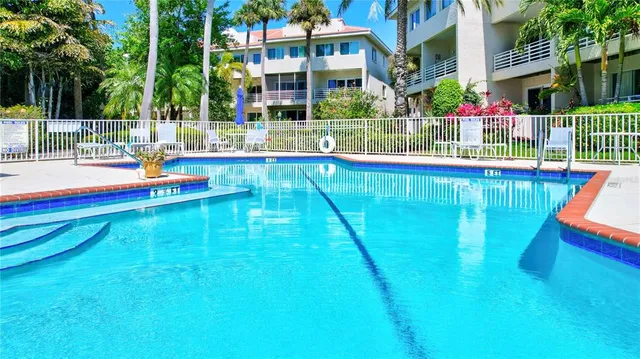 a aerial view of a house with a yard and potted plants
