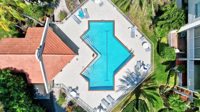 an aerial view of a house with a lake view