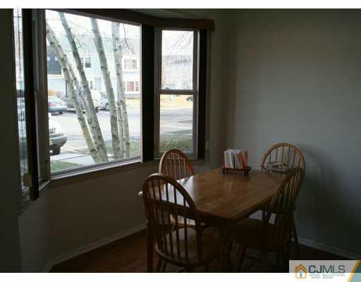 82 La Rue Lane East Brunswick, NJ 08816 - Photo 3 of 5 a view of a dining room with furniture window and outside view
