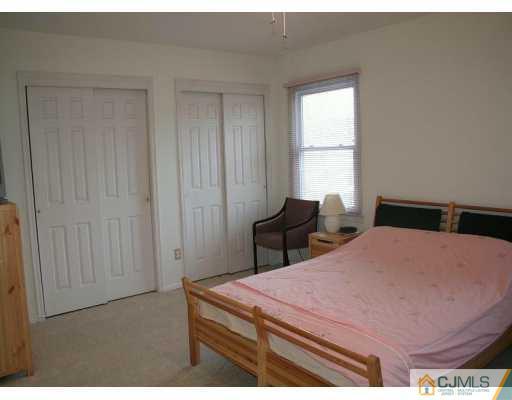 82 La Rue Lane East Brunswick, NJ 08816 - Photo 4 of 5 a bedroom with a bed and a window