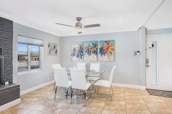 a kitchen with stainless steel appliances granite countertop a refrigerator sink and stove