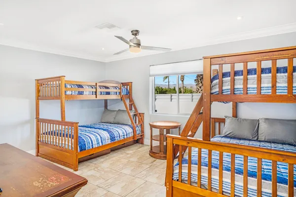a bedroom with a bed and cabinets