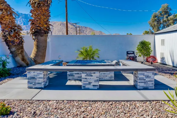 an aerial view of a house with a swimming pool