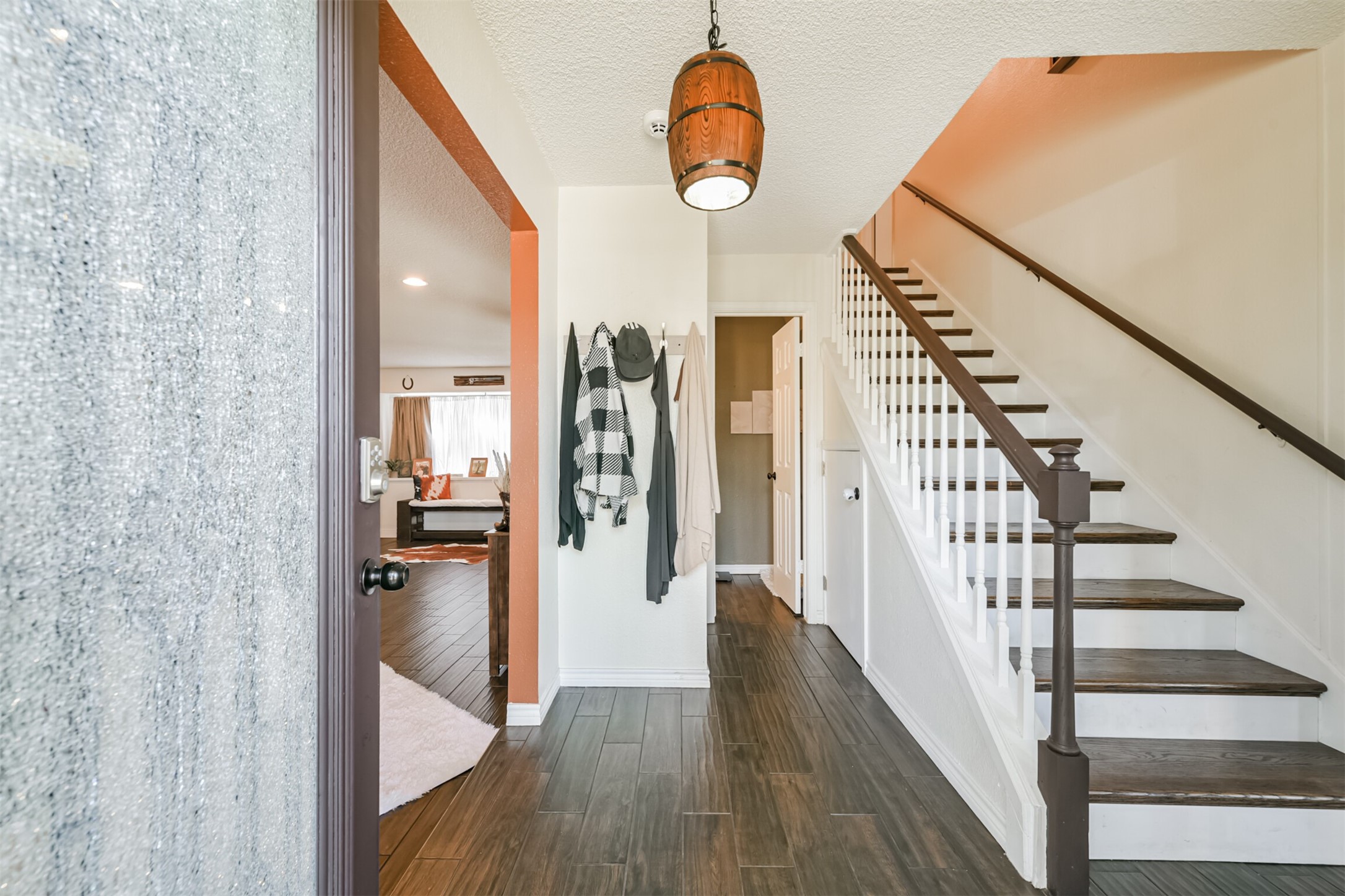 3728 Autumn Lane Baytown, TX 77521 - Photo 4 of 16 his inviting entryway welcomes you with warm wood-look flooring, a bright and open layout, and a charming staircase that adds character from the moment you walk in. The natural light flows effortlessly into the living area, creating a cozy yet spacious feel—perfect for everyday living and entertaining.