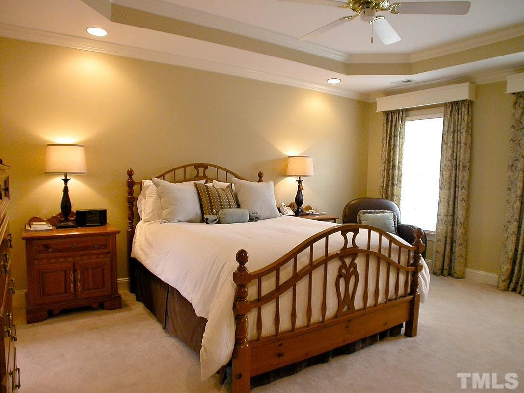 4000 Heathgate Lane Raleigh, NC 27613 - Photo 11 of 19 Has trey ceilings, recessed lighting, ceiling fan and separate His & Her closets, with built-in shelving Master Bedroom