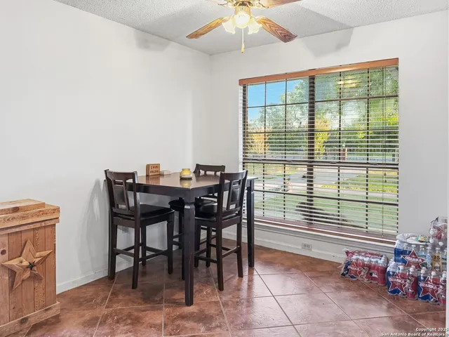 a dining room with furniture and window