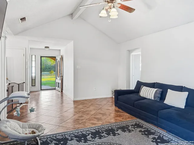 a living room with furniture and a rug