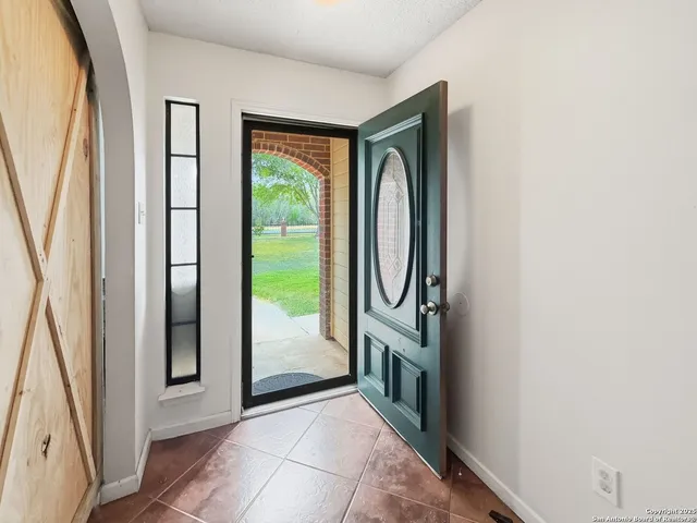 a view of empty room with floor to ceiling window