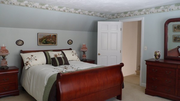 27 Westcott Road Harvard, MA 01451 - Photo 22 of 30 a bedroom with a bed and a dresser