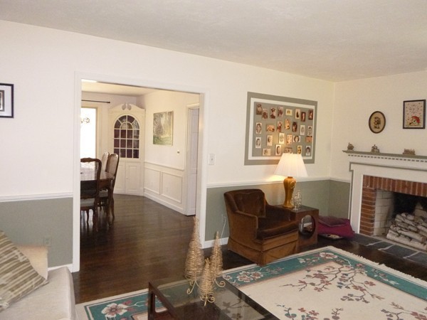27 Westcott Road Harvard, MA 01451 - Photo 5 of 30 a living room with furniture a fireplace and wooden floor