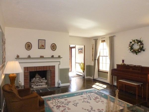 27 Westcott Road Harvard, MA 01451 - Photo 6 of 30 a living room with furniture and a fireplace
