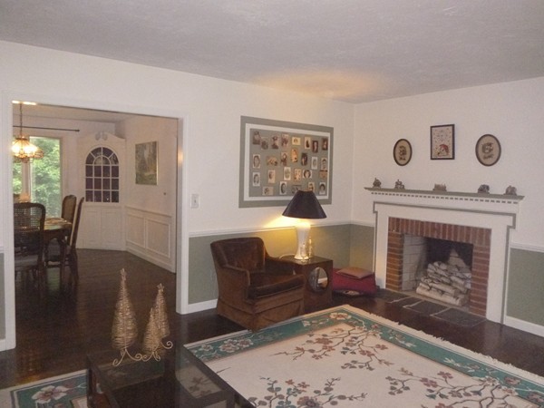 27 Westcott Road Harvard, MA 01451 - Photo 8 of 30 a living room with furniture and a fireplace