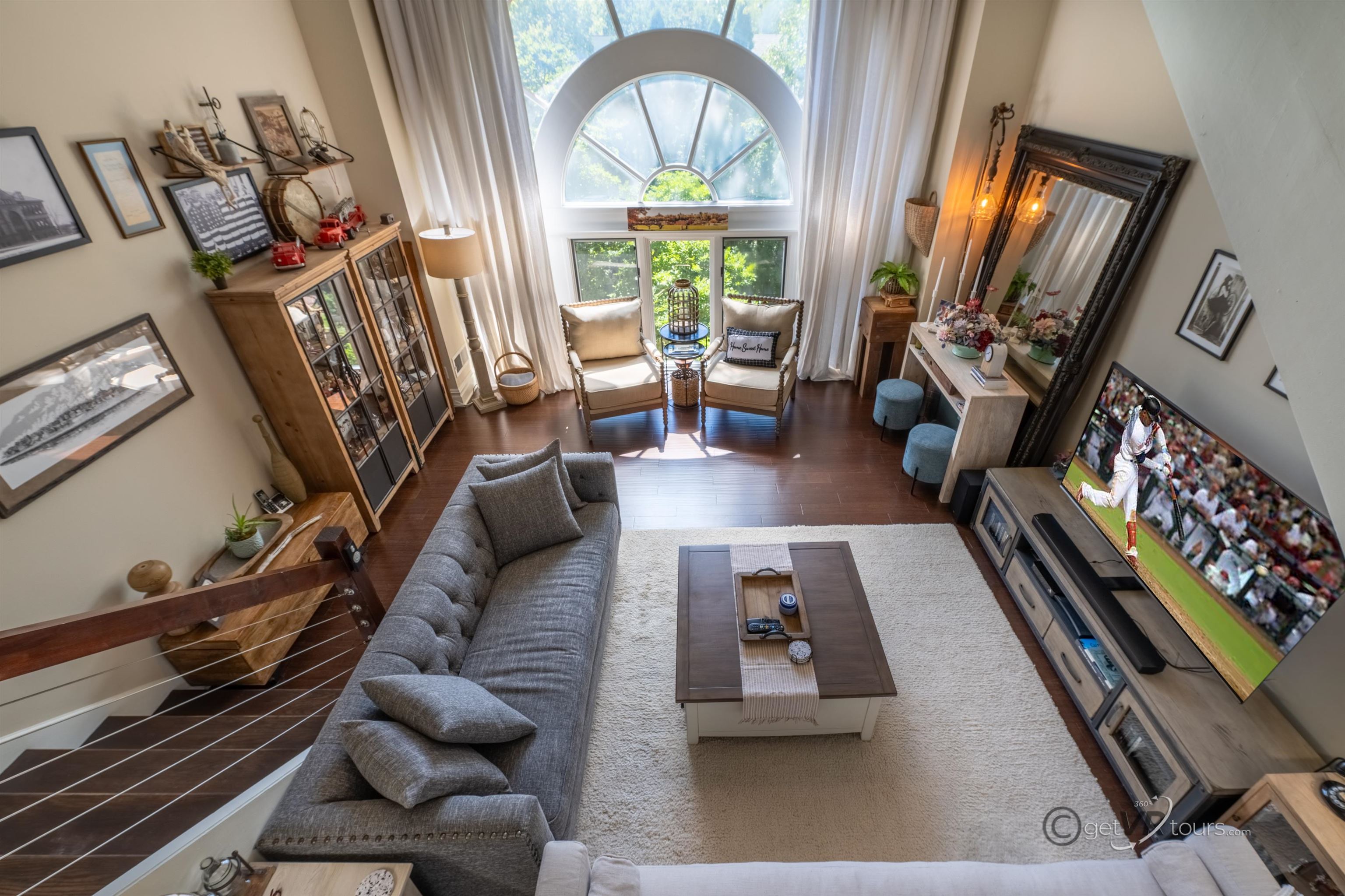 411 South Prospect Street Galena, IL 61036 - Photo 11 of 28 a living room with furniture fireplace dining table flat screen tv and windows