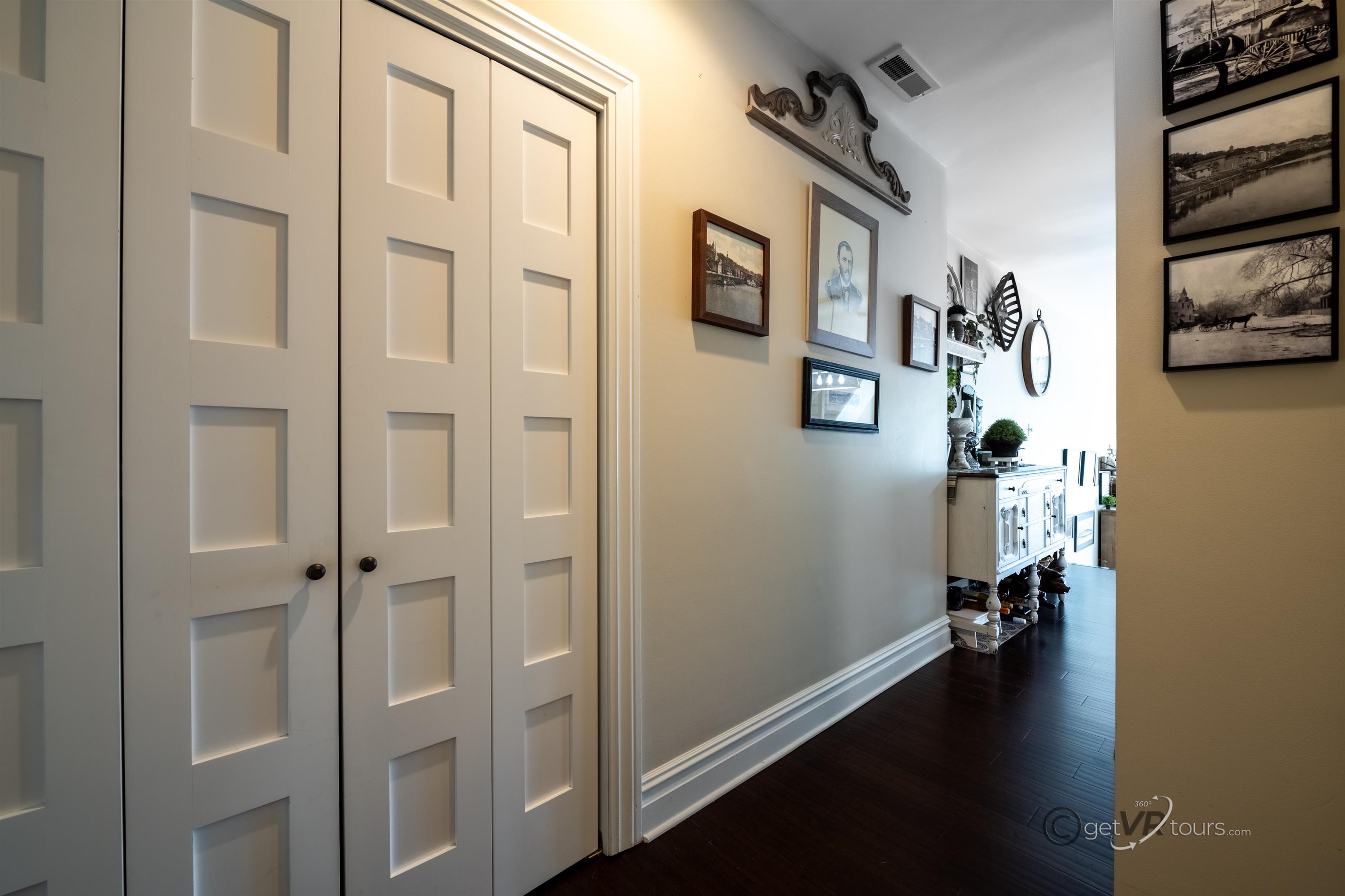 411 South Prospect Street Galena, IL 61036 - Photo 3 of 28 a view of a hallway with workspace and closet with wooden floor