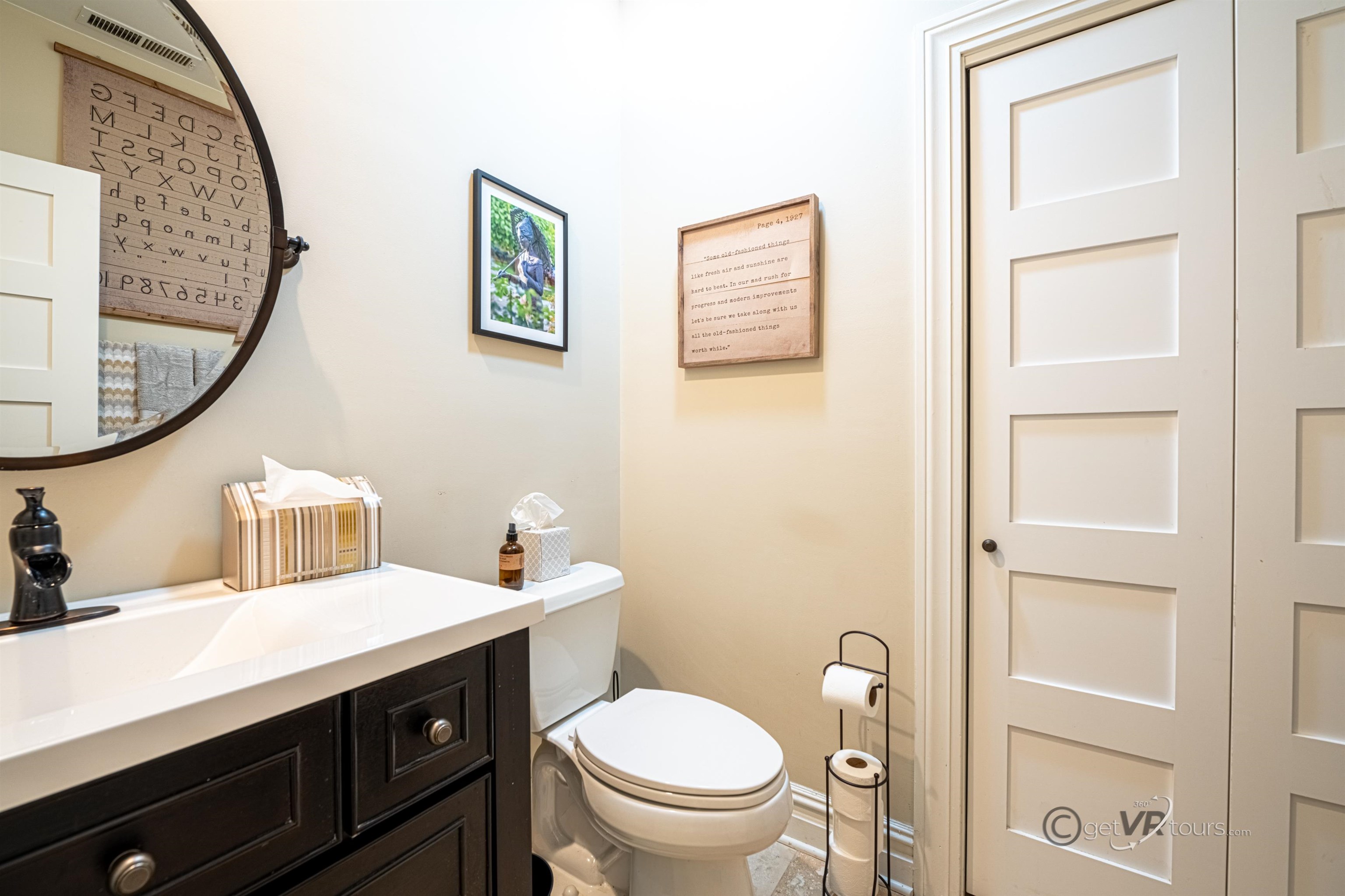 411 South Prospect Street Galena, IL 61036 - Photo 4 of 28 a bathroom with a toilet sink and mirror