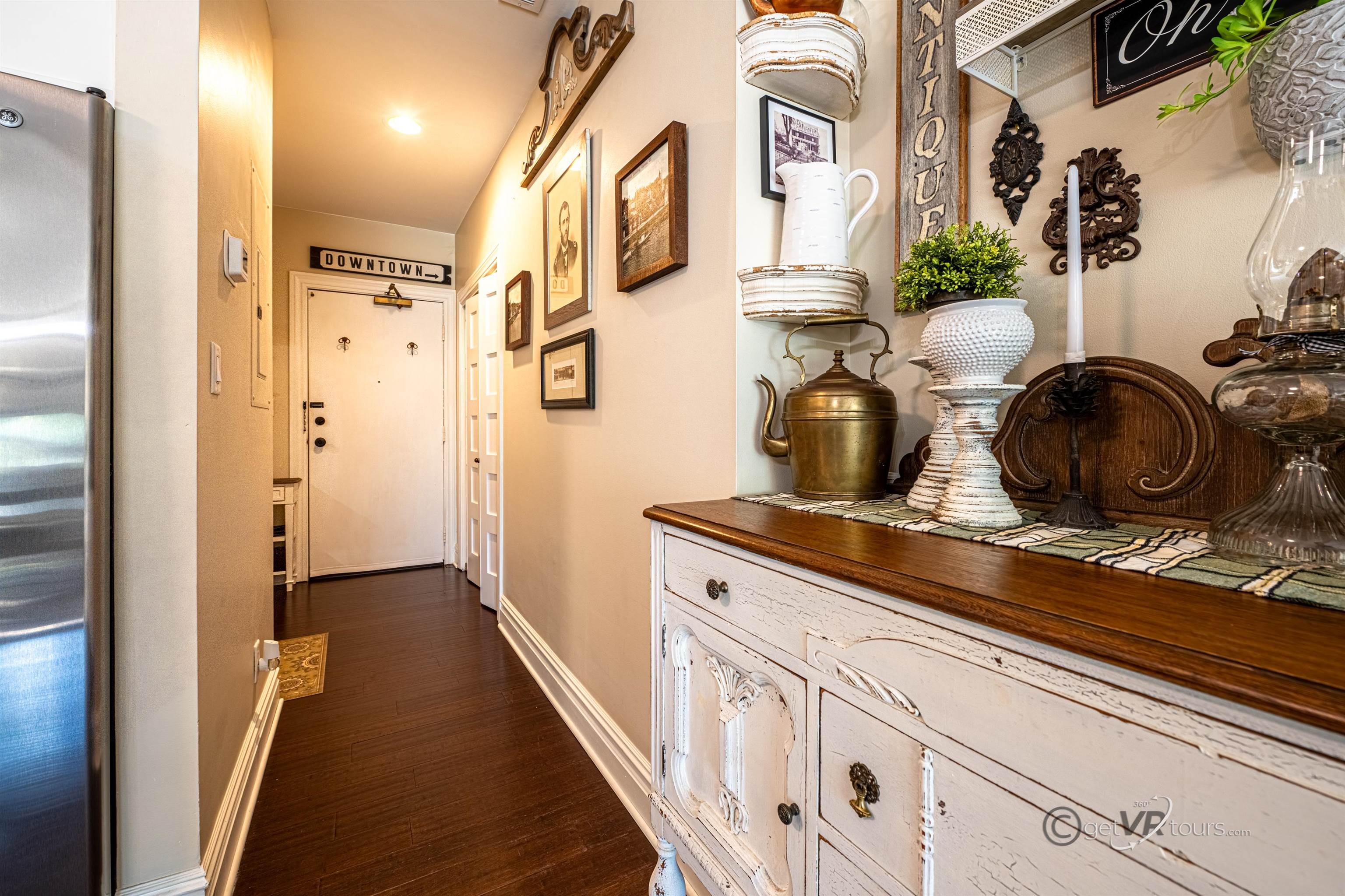 411 South Prospect Street Galena, IL 61036 - Photo 5 of 28 a hallway with white cabinets and wooden floor