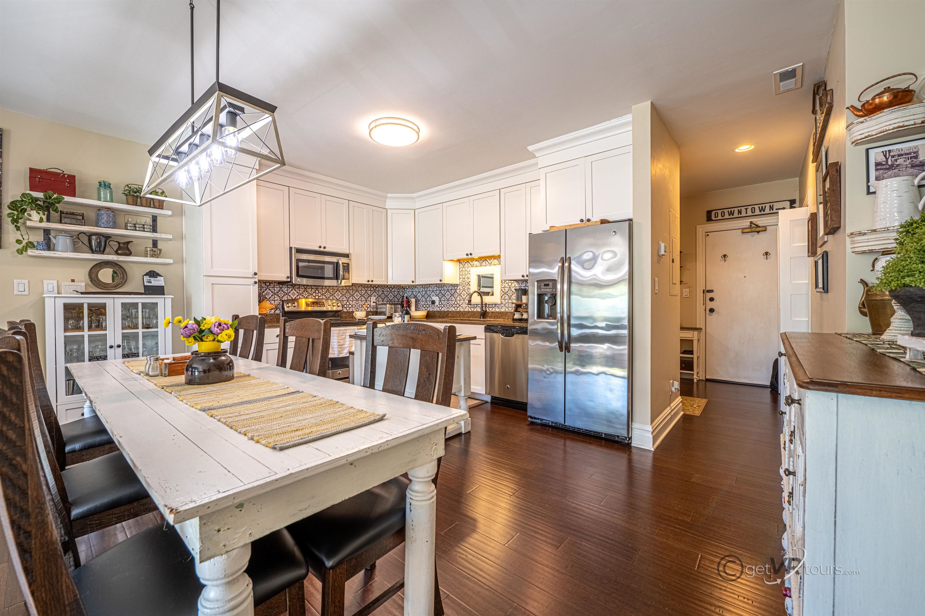 411 South Prospect Street Galena, IL 61036 - Photo 6 of 28 a large kitchen with a table and chairs