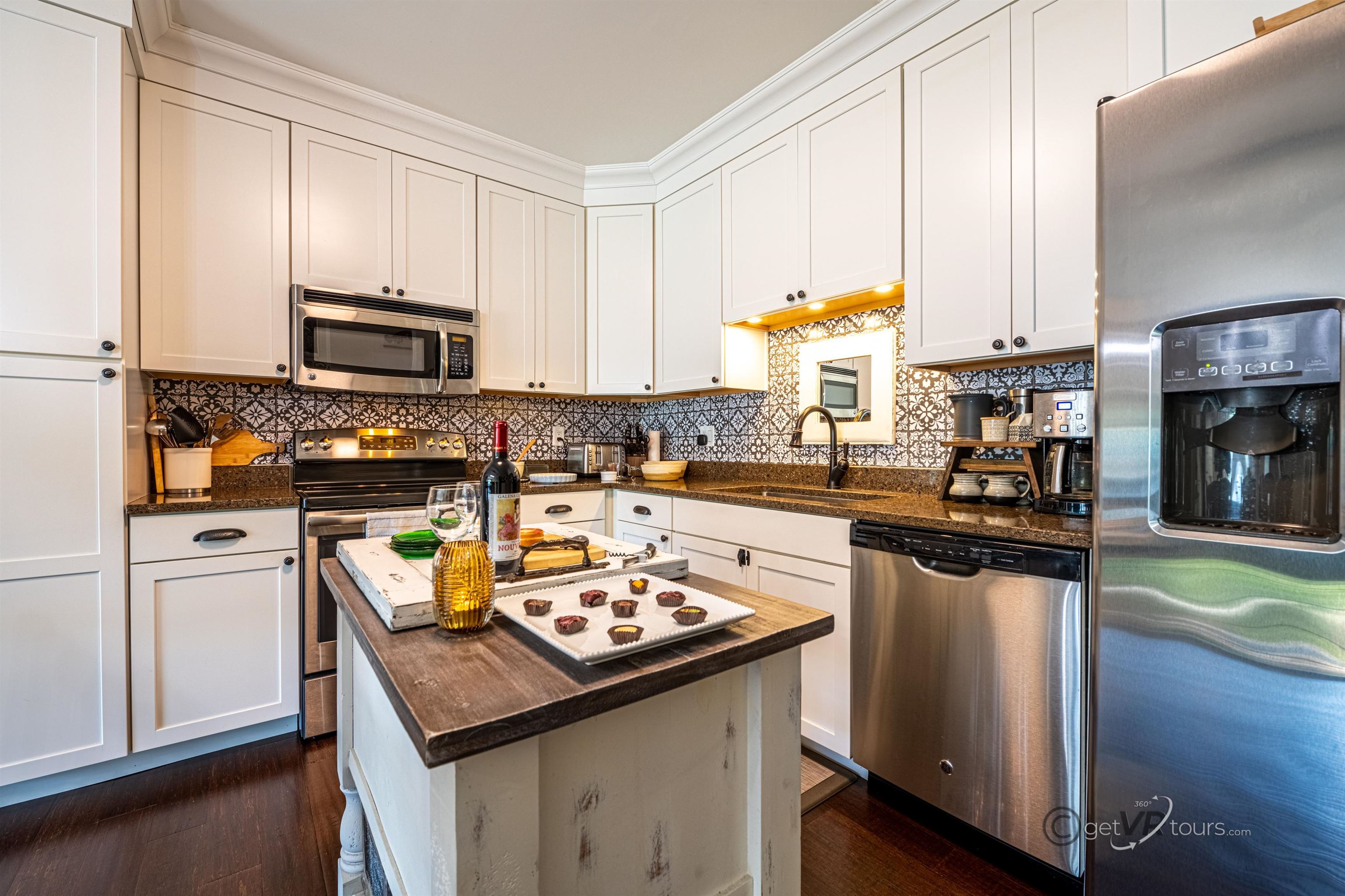 411 South Prospect Street Galena, IL 61036 - Photo 7 of 28 a kitchen with a stove a sink and a refrigerator