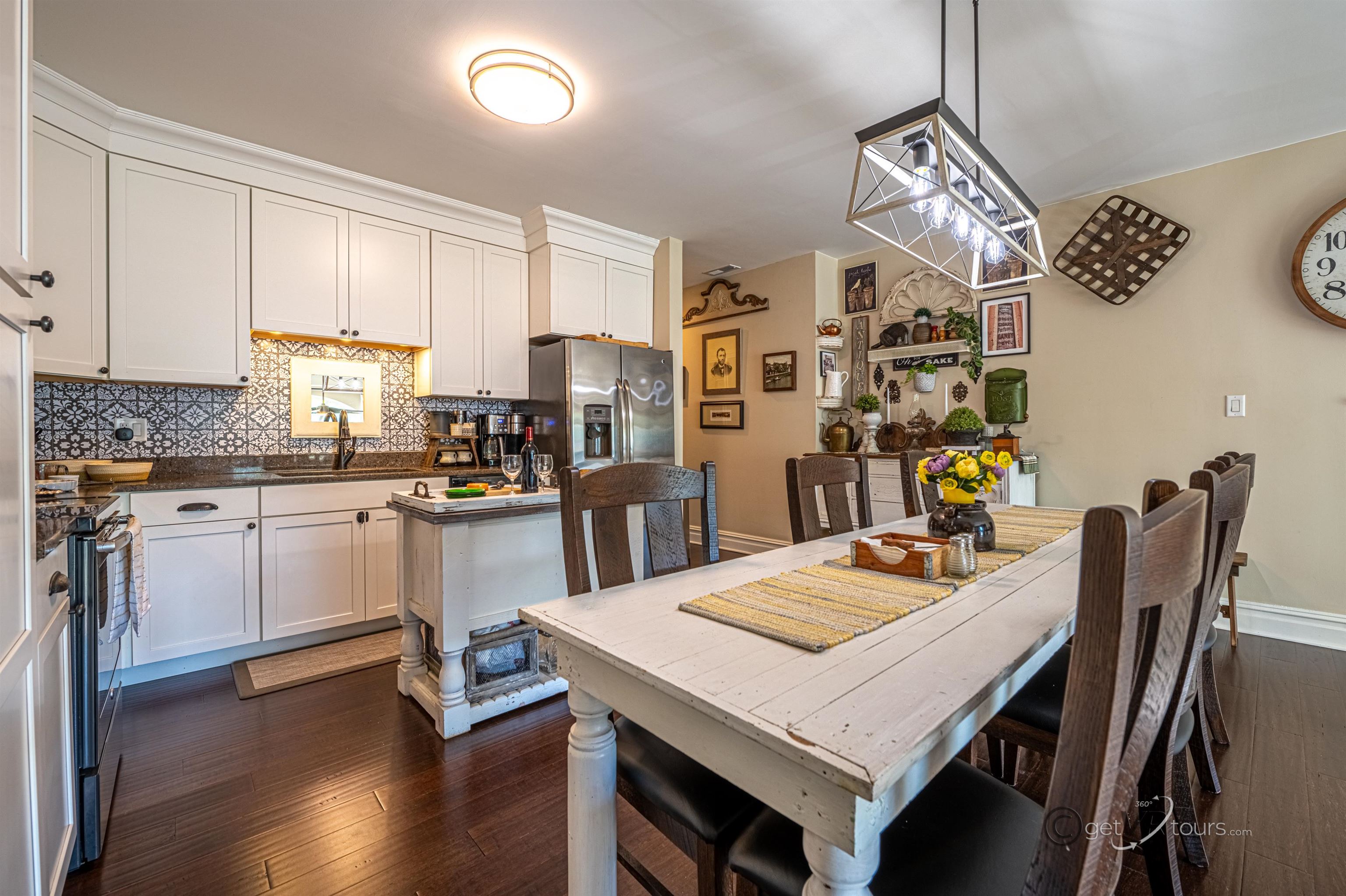 411 South Prospect Street Galena, IL 61036 - Photo 9 of 28 a kitchen with a dining table chairs and refrigerator
