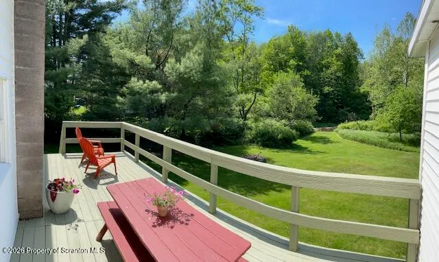 a view of balcony with furniture
