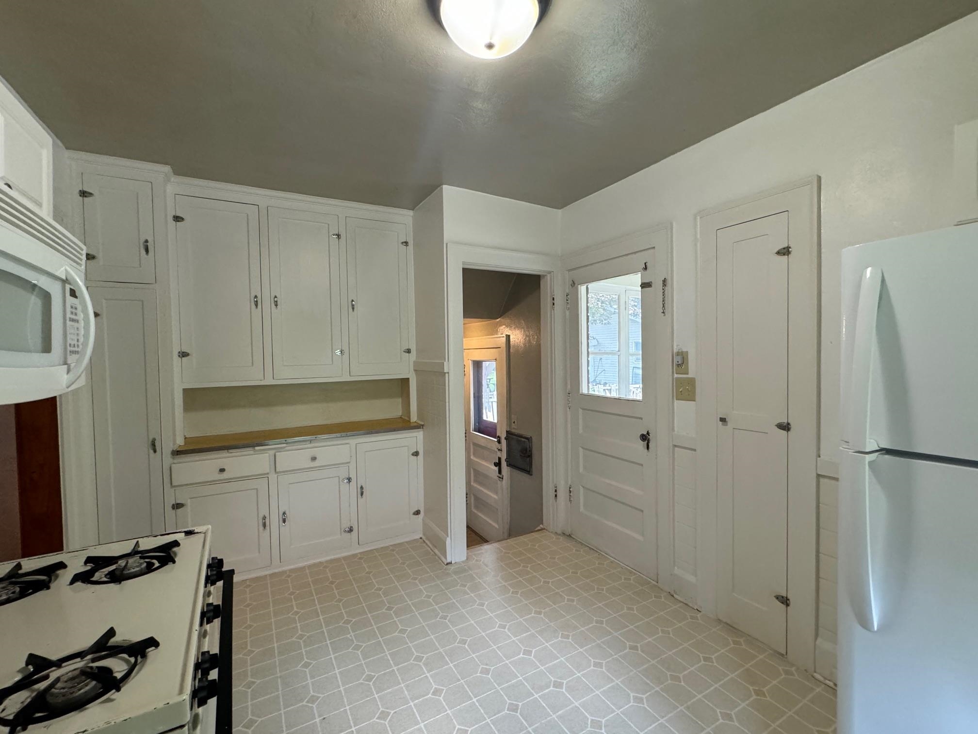 2231 9th Avenue Rockford, IL 61104 - Photo 13 of 44 a view of a kitchen with refrigerator and cabinet