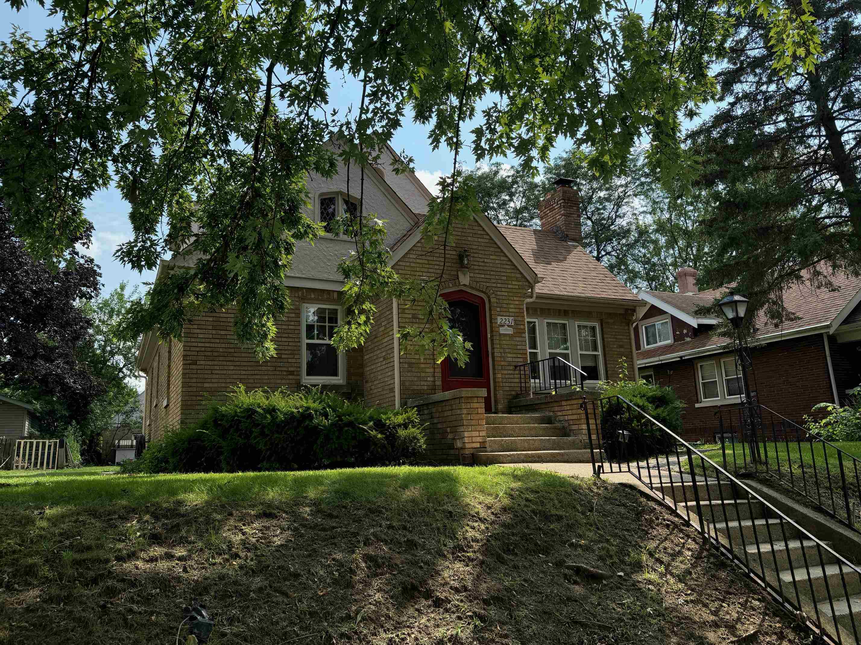 2231 9th Avenue Rockford, IL 61104 - Photo 2 of 44 a front view of a house with yard and green space