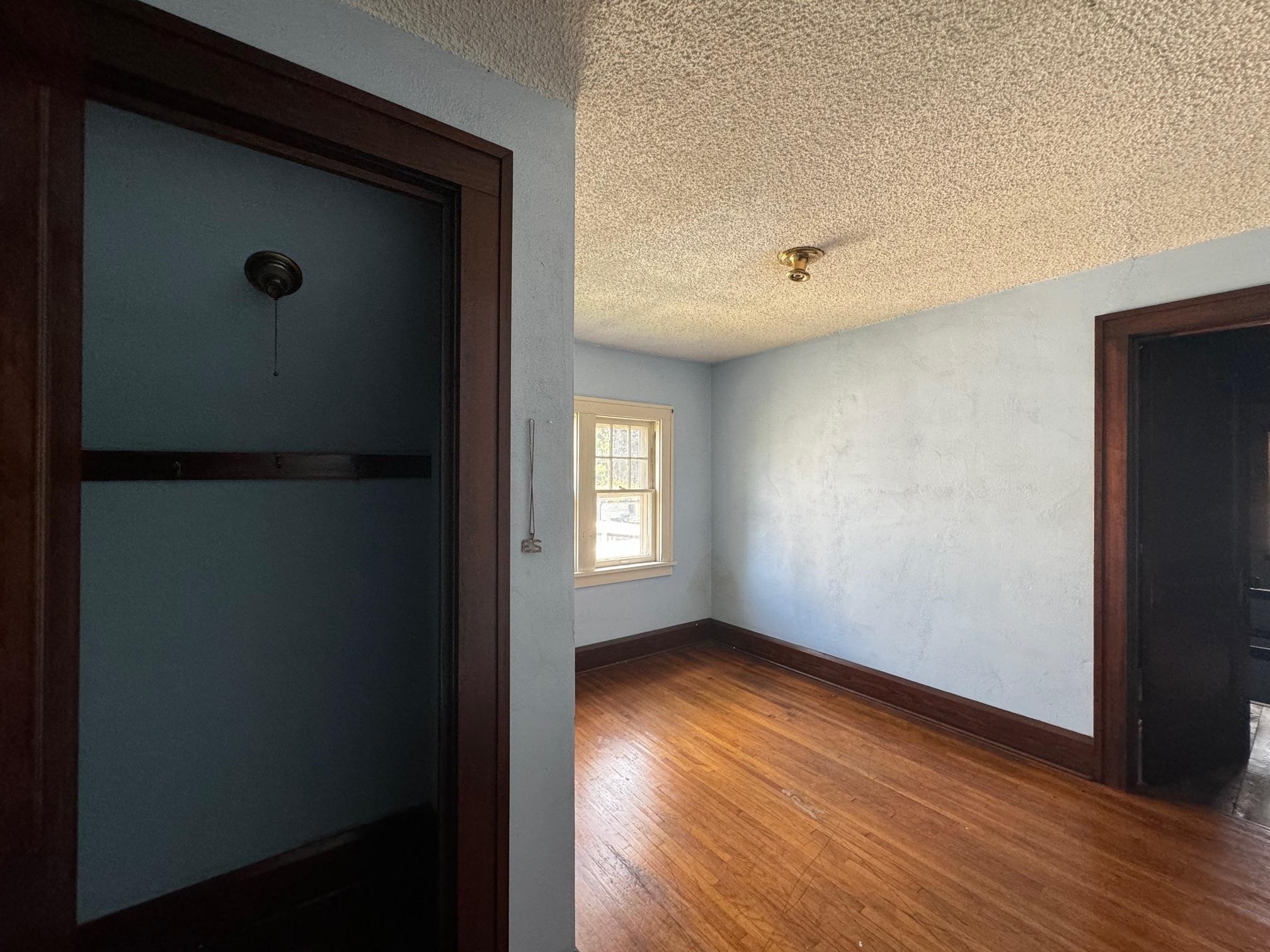 2231 9th Avenue Rockford, IL 61104 - Photo 26 of 44 a view of an empty room with wooden floor and a window