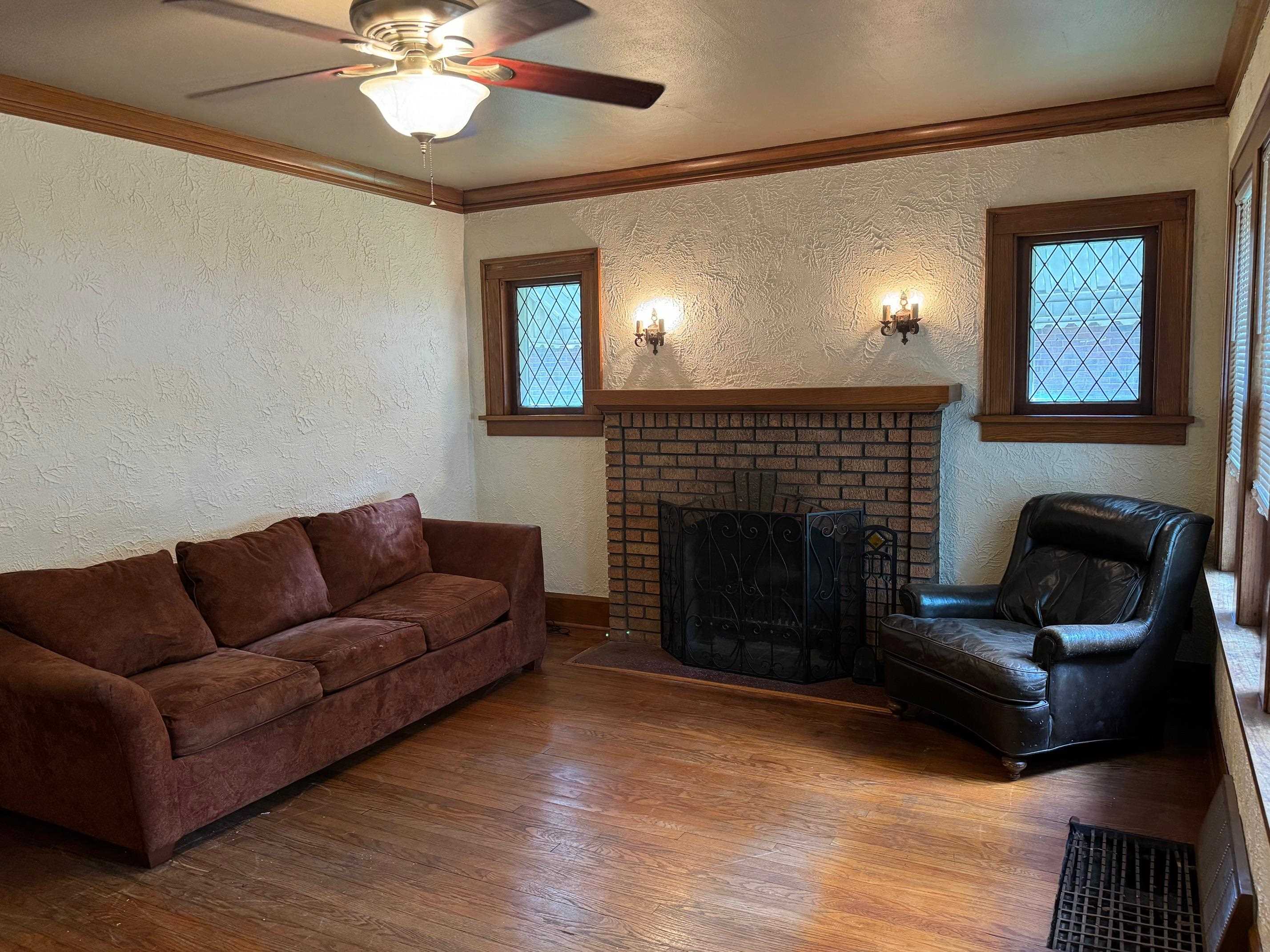 2231 9th Avenue Rockford, IL 61104 - Photo 6 of 44 a living room with furniture and a fireplace