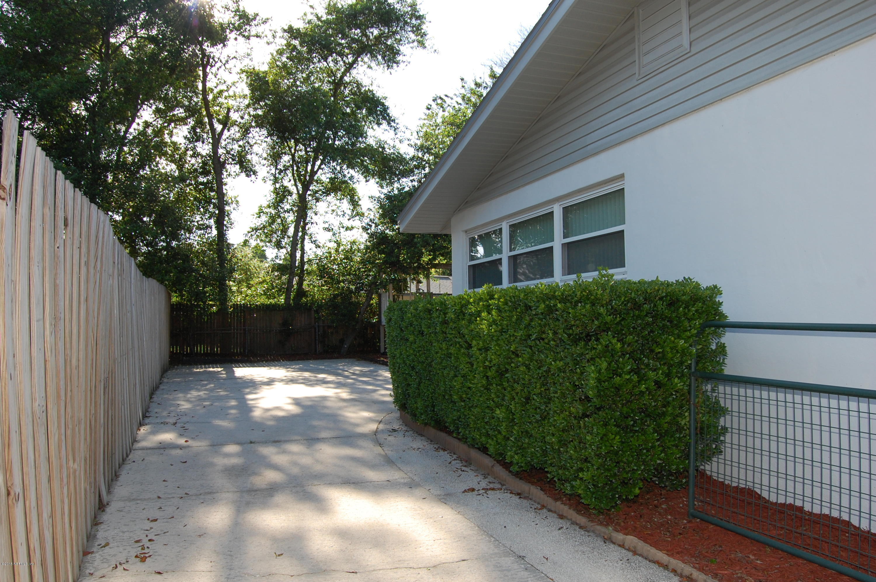 3734 Gurley Road Jacksonville, FL 32277 - Photo 28 of 38 a view of backyard with plants and trees