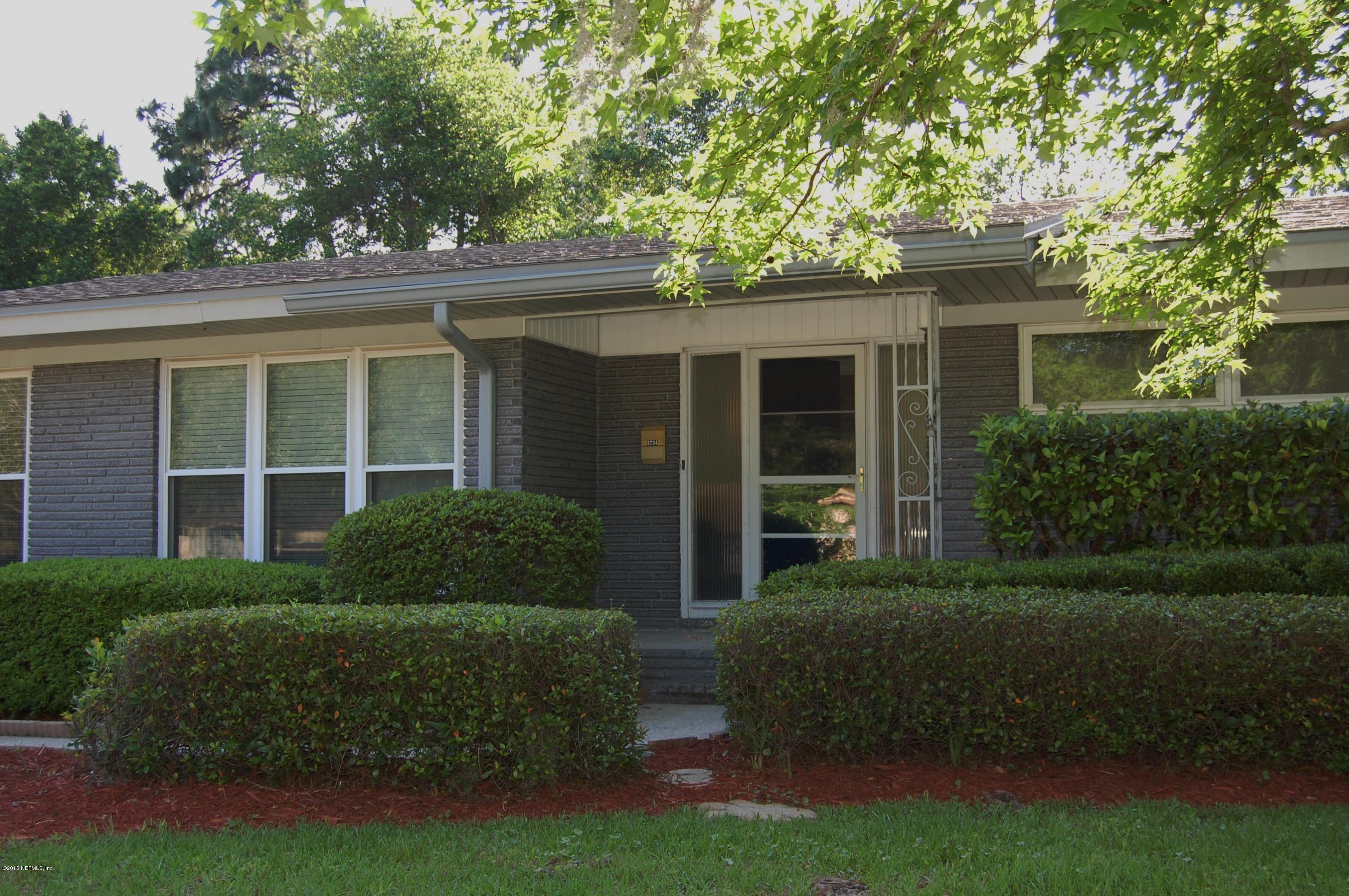 3734 Gurley Road Jacksonville, FL 32277 - Photo 4 of 38 a view of a house with a garden