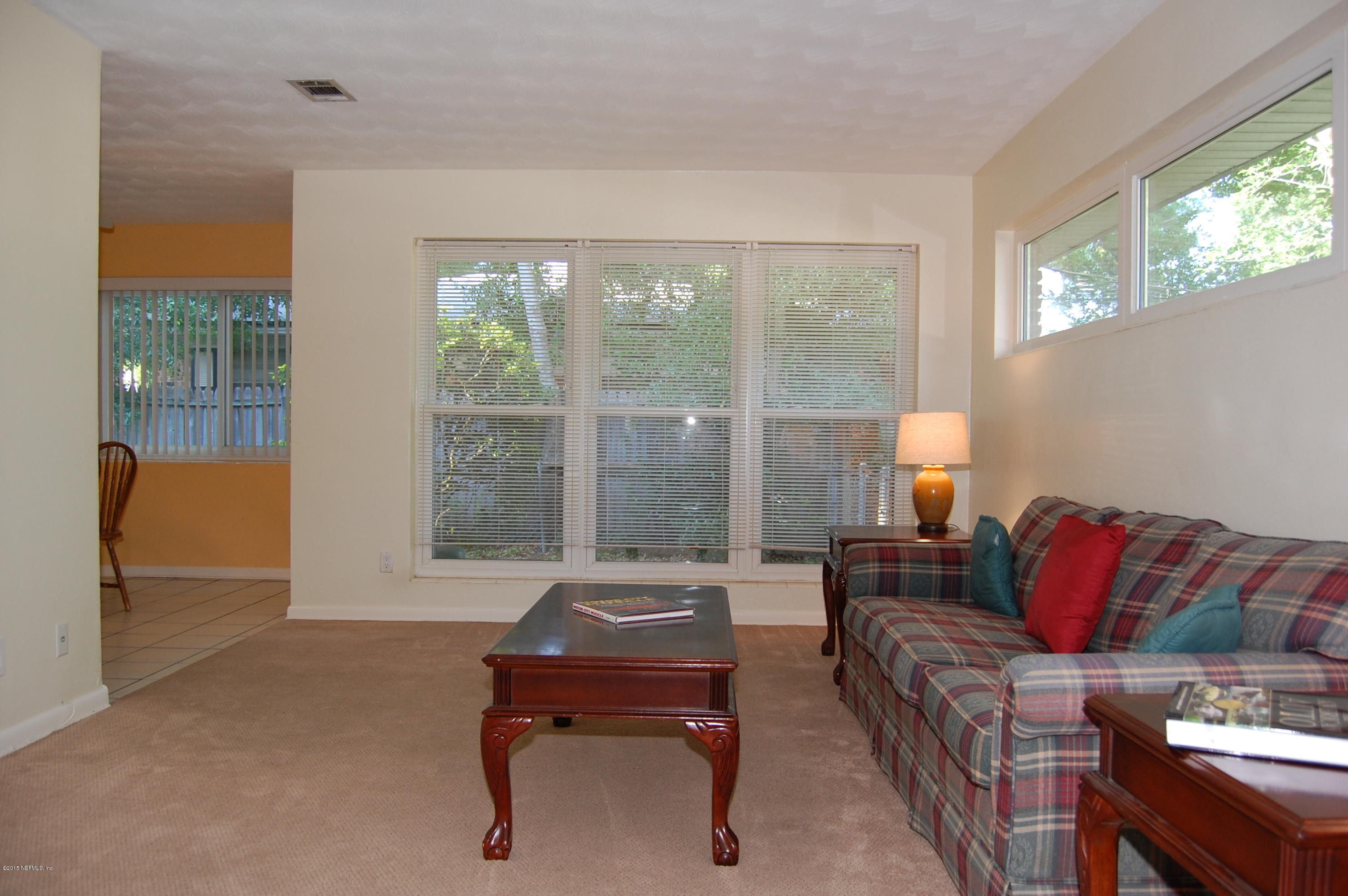3734 Gurley Road Jacksonville, FL 32277 - Photo 8 of 38 a living room with furniture and a window