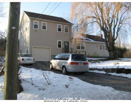 64 Miller Road Preston, CT 06365 - Photo 1 of 1 a car parked in front of a white house