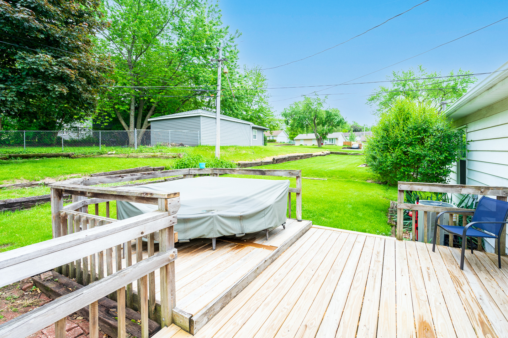 204 MacIntyre Street Lockport, IL 60441 - Photo 21 of 27 a view of a swimming pool with a deck and a garden