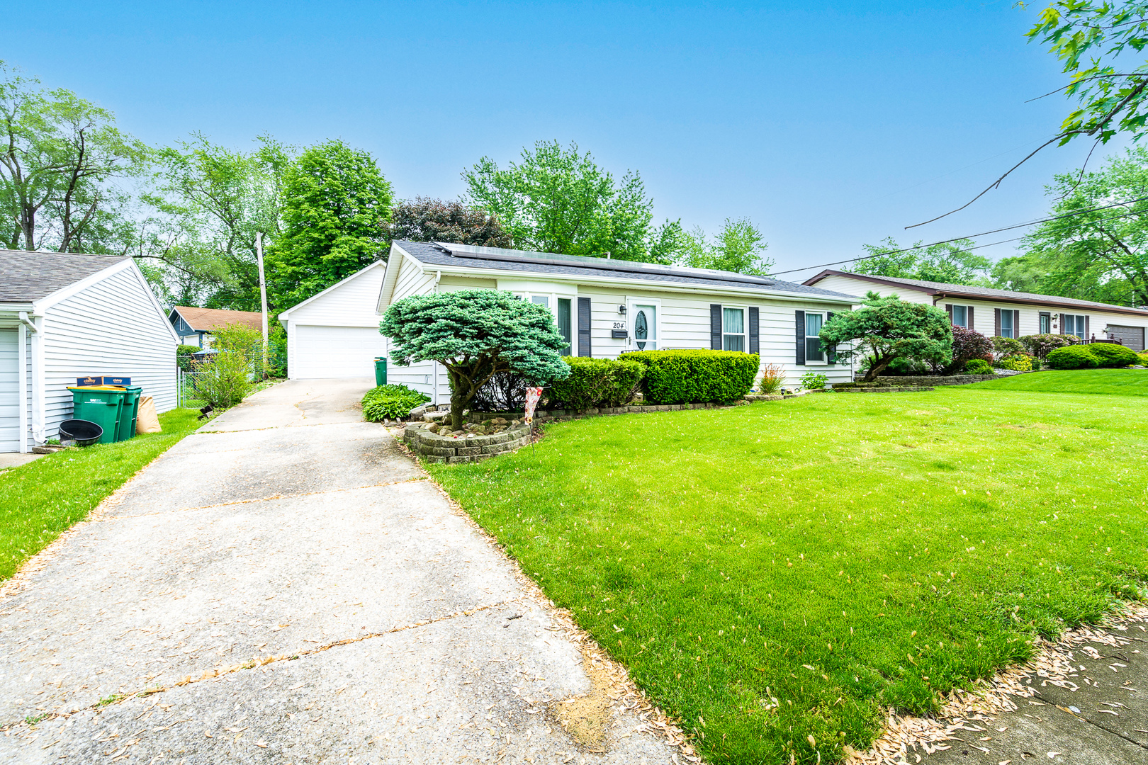 204 MacIntyre Street Lockport, IL 60441 - Photo 23 of 27 a front view of a house with garden