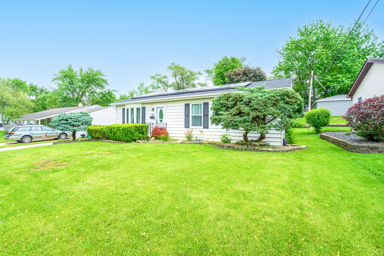 204 MacIntyre Street Lockport, IL 60441 - Photo 25 of 27 a view of a house with backyard sitting area and garden